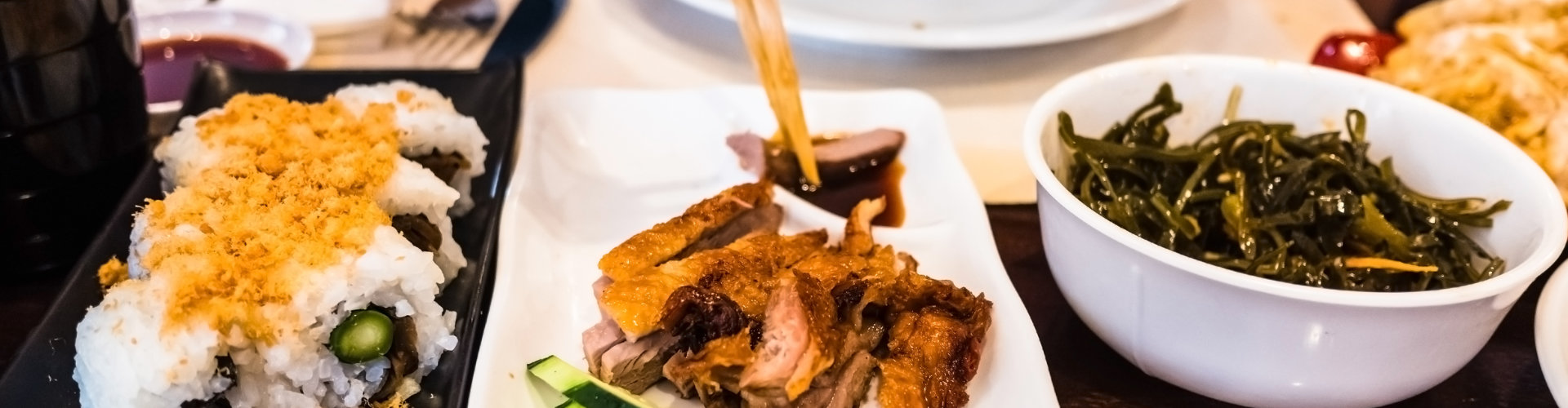 Crispy Duck with Sushi in Restaurant